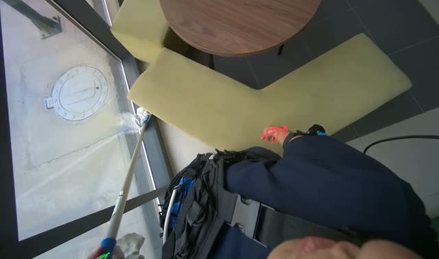Cleaning glass wall with long-handled tool: egocentric robotics sample