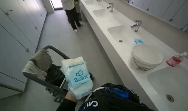 Preparing cleaning cart and supplies: egocentric robotics sample