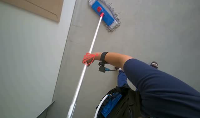 Mopping floor with flat mop: egocentric robotics sample