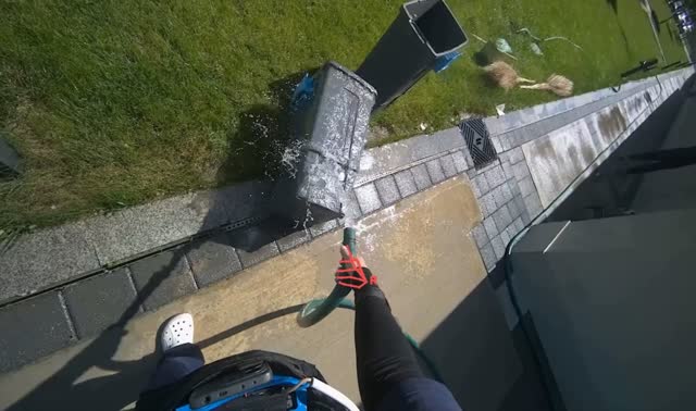 Spraying water to clean bins and surrounding area: egocentric robotics sample