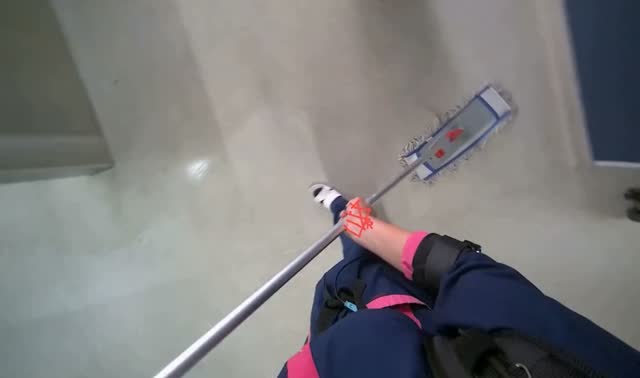 Mopping floor with flat mop: egocentric robotics sample