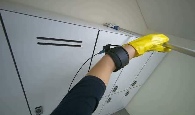 Wiping lockers and bench with duster: egocentric robotics sample