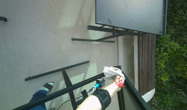 Wiping outdoor table frame: egocentric robotics sample