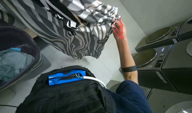 Unloading and folding laundry into storage: egocentric robotics sample