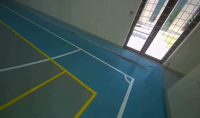 Mopping blue sports hall floor: egocentric robotics sample