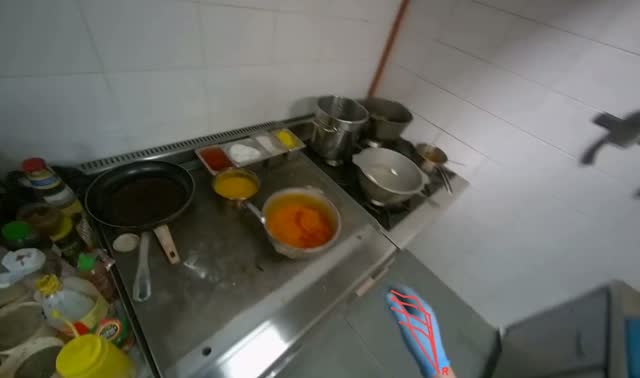 Stirring ingredients in pot on cooker: egocentric robotics sample
