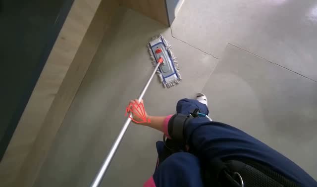 Mopping floor with flat mop: egocentric robotics sample