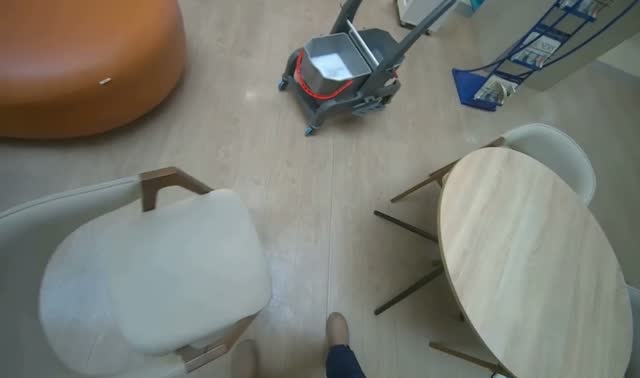 Mopping light-colored floor: egocentric robotics sample