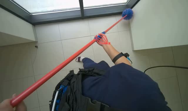 Dusting high surfaces in hallway: egocentric robotics sample
