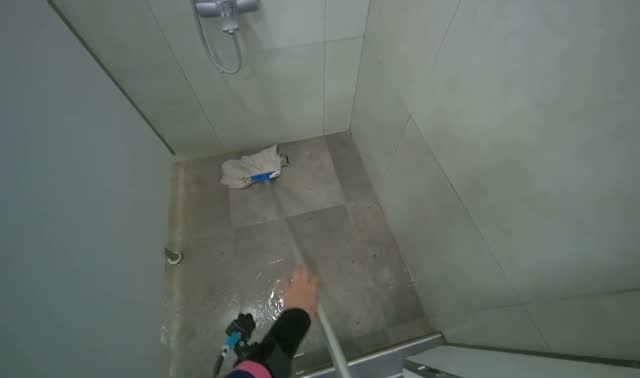 Mopping shower stall floor: egocentric robotics sample
