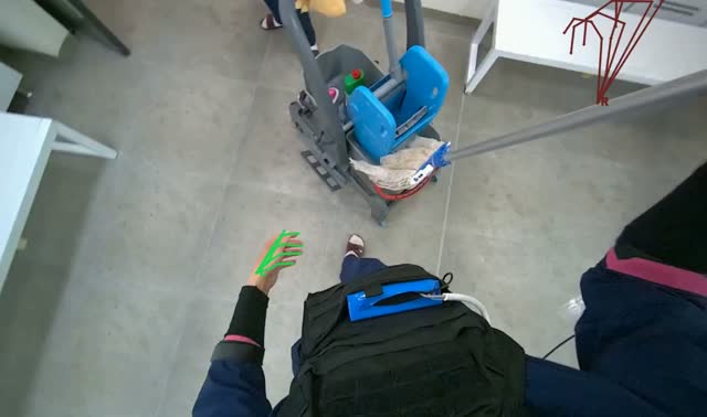 Mopping floor with mop: egocentric robotics sample