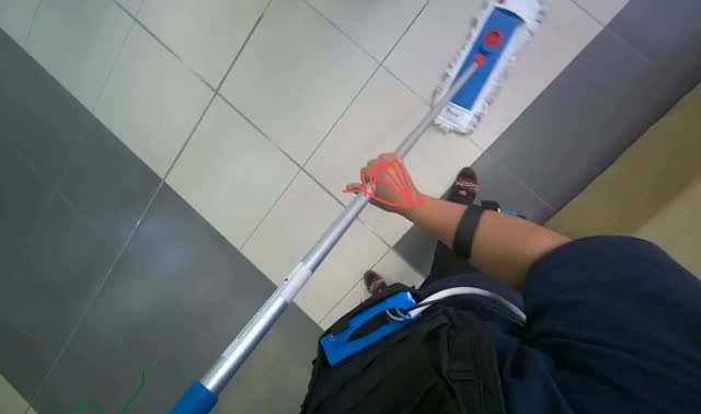 Mopping floor with white flat mop: egocentric robotics sample