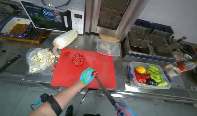 Chopping tomatoes on cutting board: egocentric robotics sample