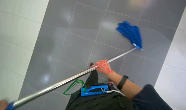 Mopping floor with string mop: egocentric robotics sample