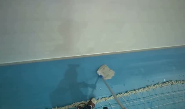 Mopping blue sports hall floor: egocentric robotics sample