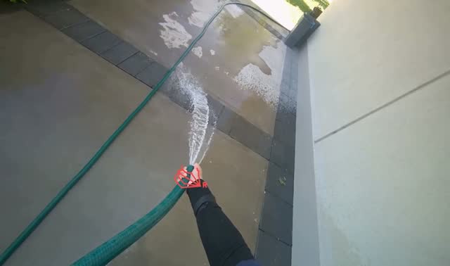 Spraying water on building exterior and sidewalk: egocentric robotics sample
