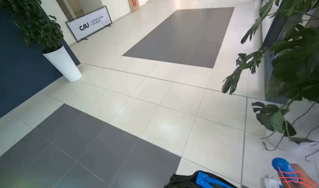 Dry mopping floor with white mop: egocentric robotics sample