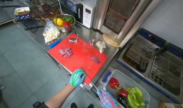 Slicing meat on cutting board: egocentric robotics sample