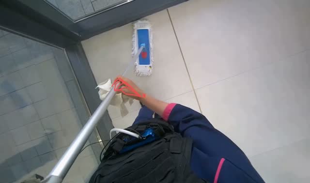 Mopping floor with mop: egocentric robotics sample