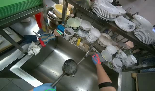 Placing water on gas stove to boil: egocentric robotics sample