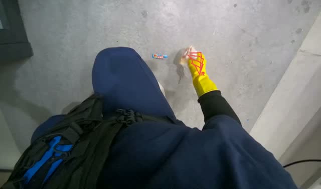 Collecting trash from the floor into plastic bin: egocentric robotics sample
