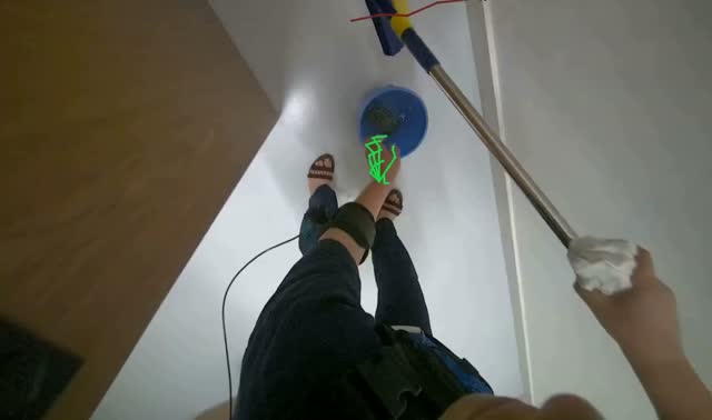 Cleaning ceiling with squeegee: egocentric robotics sample