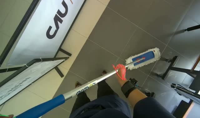 Mopping tiled floor with flat mop: egocentric robotics sample