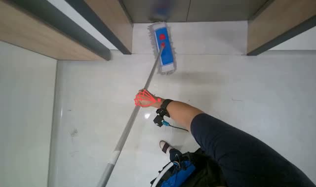 Mopping floor with flat mop: egocentric robotics sample