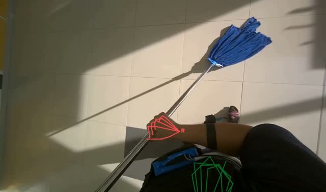 Mopping floor with string mop: egocentric robotics sample