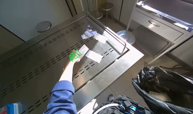 Collecting trash from stainless steel table: egocentric robotics sample