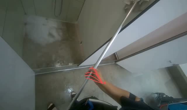 Cleaning shower walls with mop: egocentric robotics sample
