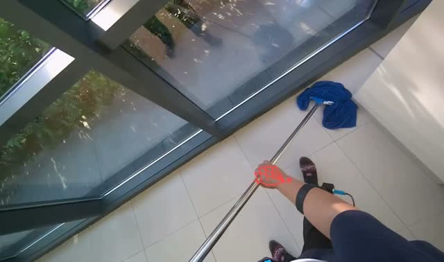Mopping floor with flat mop: egocentric robotics sample