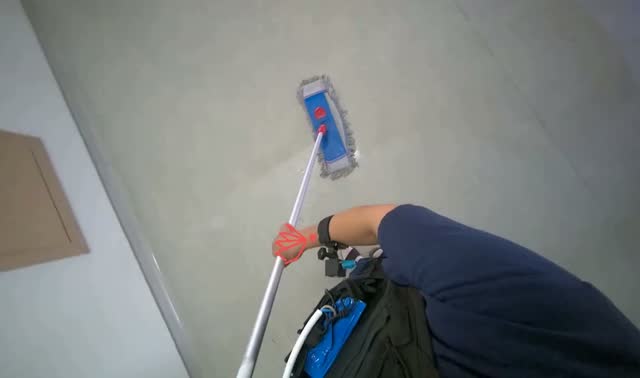 Mopping floor with flat mop: egocentric robotics sample