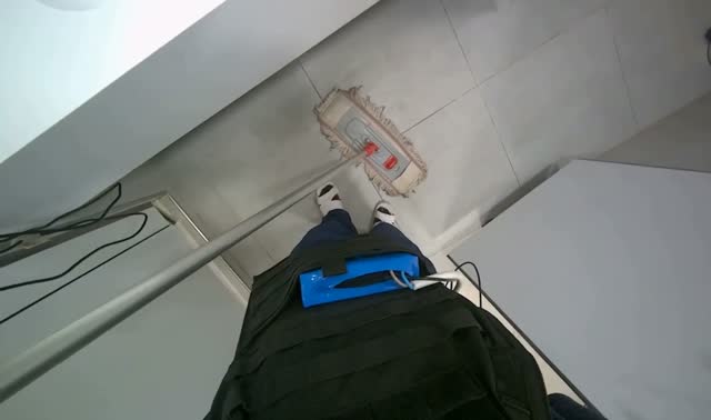 Mopping bathroom floor: egocentric robotics sample