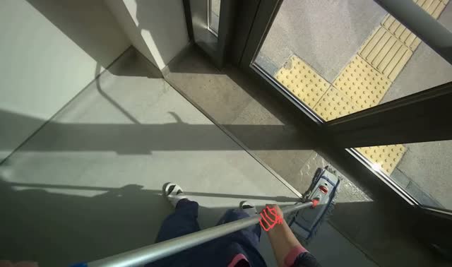 Mopping floor with flat mop: egocentric robotics sample