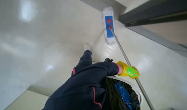 Mopping floor with flat mop: egocentric robotics sample