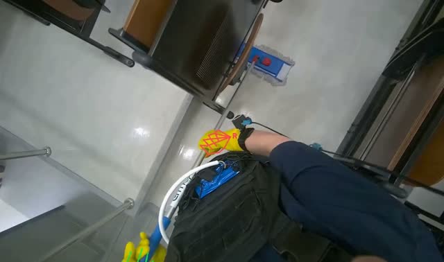 Mopping floor with flat mop: egocentric robotics sample