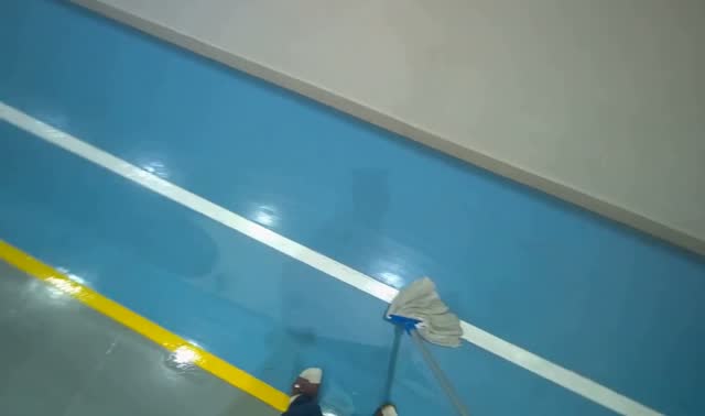 Mopping blue sports hall floor: egocentric robotics sample