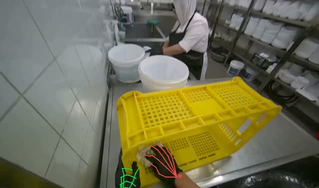 Wiping yellow crate: egocentric robotics sample