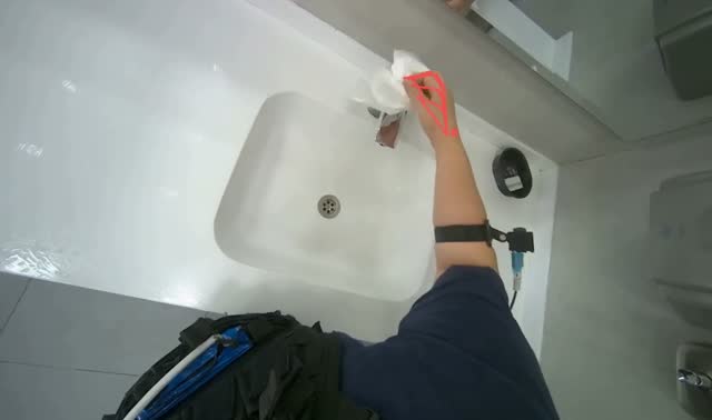 Wiping around sink with paper towel: egocentric robotics sample