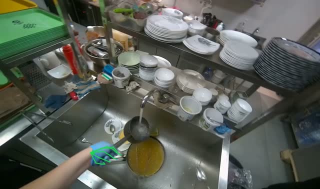 Emptying dirty water and adding fresh water to stove: egocentric robotics sample