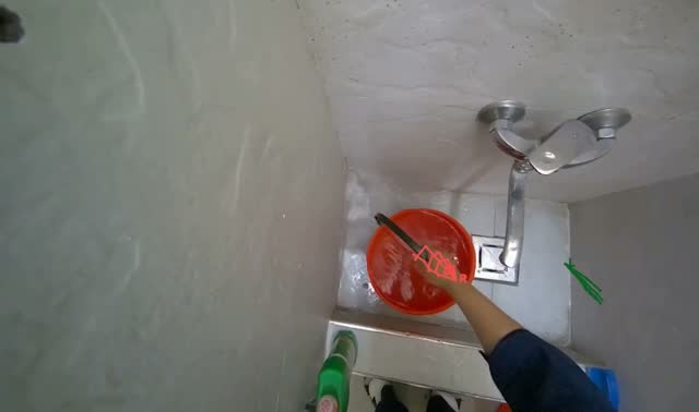 Filling cleaning buckets with water: egocentric robotics sample