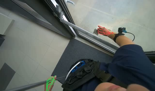 Wiping glass door frame with cloth: egocentric robotics sample