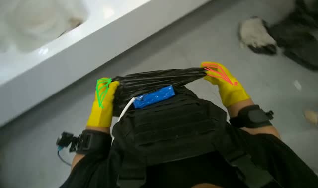 Collecting trash and bagging it: egocentric robotics sample
