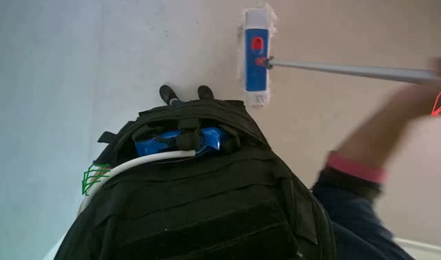 Mopping floor with flat mop: egocentric robotics sample