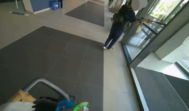 Mopping floor near glass door: egocentric robotics sample