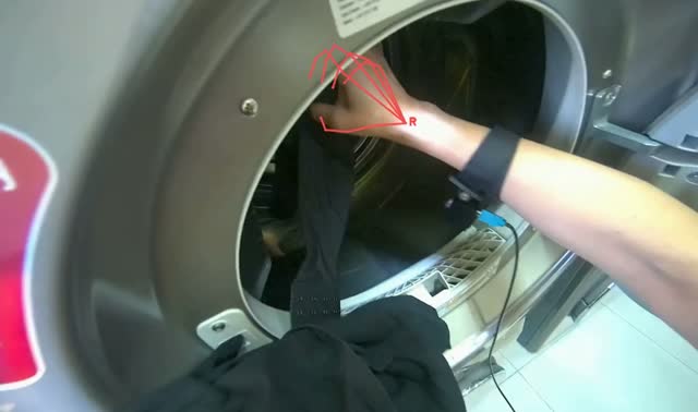 Unloading finished laundry into basket: egocentric robotics sample