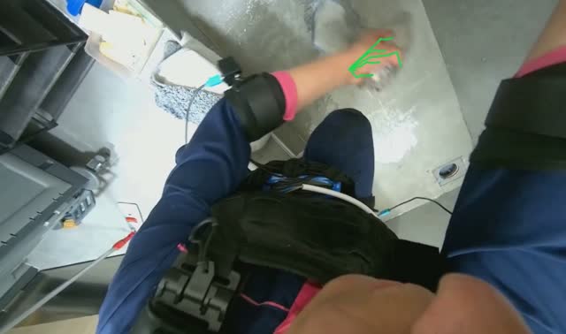 Scrubbing floor with brush and mop head: egocentric robotics sample