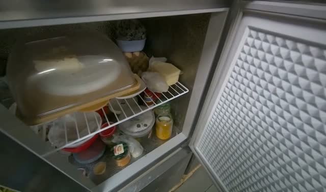 Taking product from refrigerator Discretion: The worker takes the required product from the refrigerator.: egocentric robotics sample