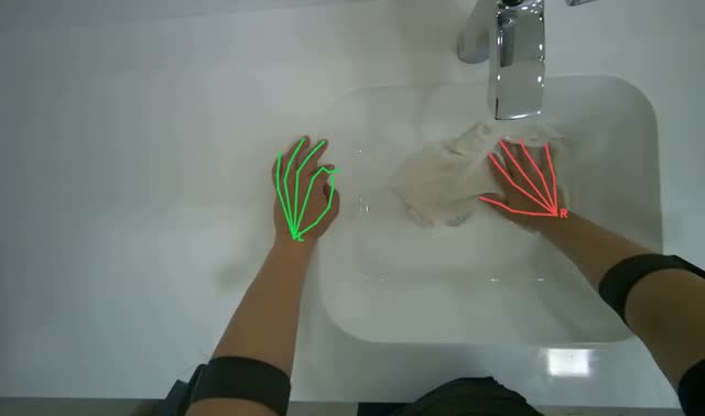 Rinsing cleaning cloth in sink: egocentric robotics sample
